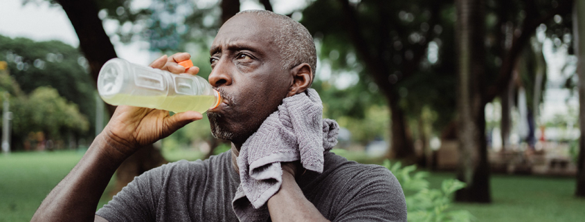 Hydration & Longevity: Man hydrating after vigorous workout
